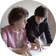 Two women reviewing business documents.