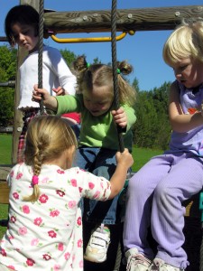 Children on an outside playset.