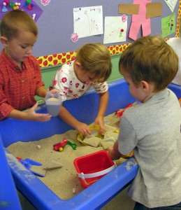 Children at a sandtable.