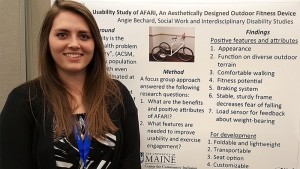 Angie Bechard with her poster featuring the AFARI mobility device.