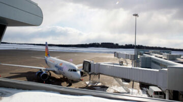Allegiant Airlines plane parked at a gate at Bangor International Airport.