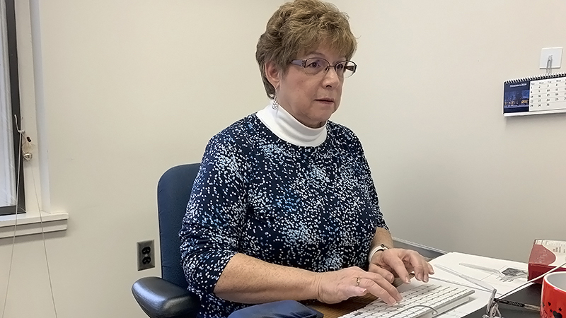 Bonnie Robinson working at her computer.