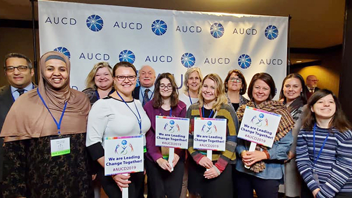 Cindy Thielen, front row, third from left, in a group of AUCD Conference attendees.