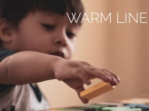 Toddler playing with blocks. Warm Line.