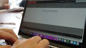 Laptop with the words, Let's Get Started written on a document.