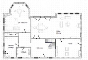 A floor plan of a home showing the first floor layout of kitchen, living room, laundry, bath.