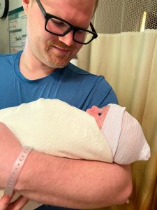 Todd Nason holding his newborn son, Teddy.
